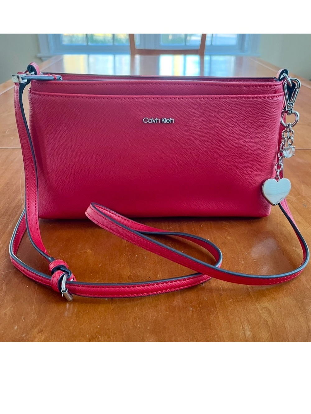 NWOT Calvin Klein Coral Red Crossbody or Shoulder Bag with Silver Heart Charm.